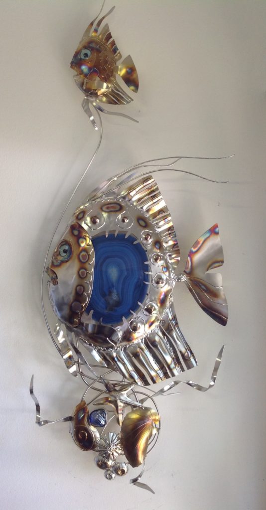 Double fish and shell feature wall hanging. Handcrafted in 316 stainless steel and inset with glass.