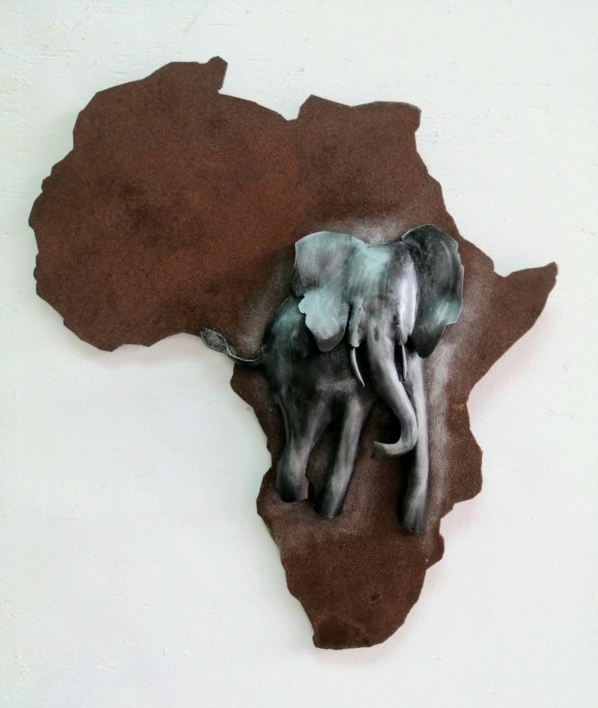 Africa ,in rusted metal with an elephant 