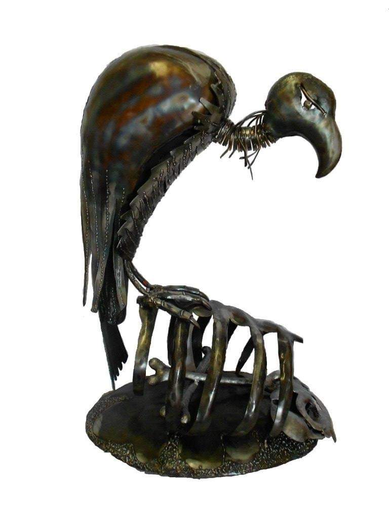 Treated steel Vulture perched on a ribcage