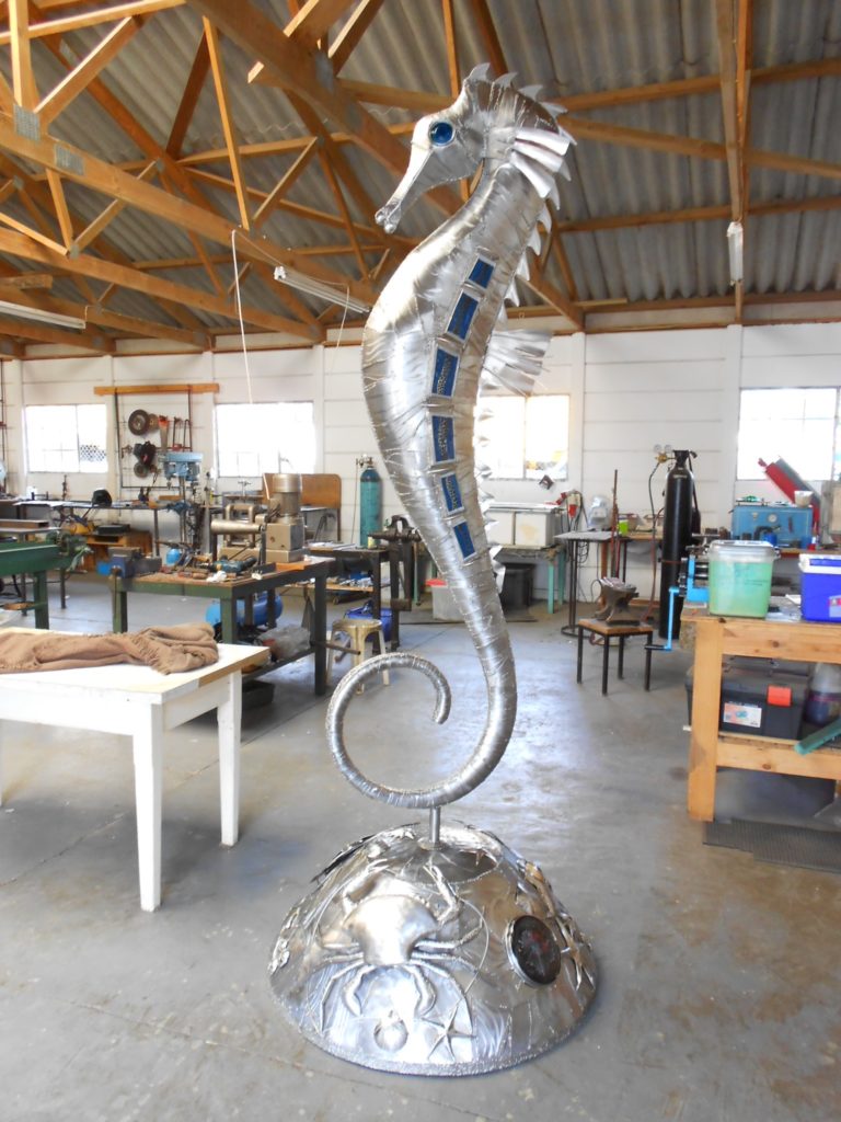 Large standing seahorse, manufactured in high grade 316 stainless steel and inset with hand slumped glass sections. the bas has various sea creatures inset with glass an agates